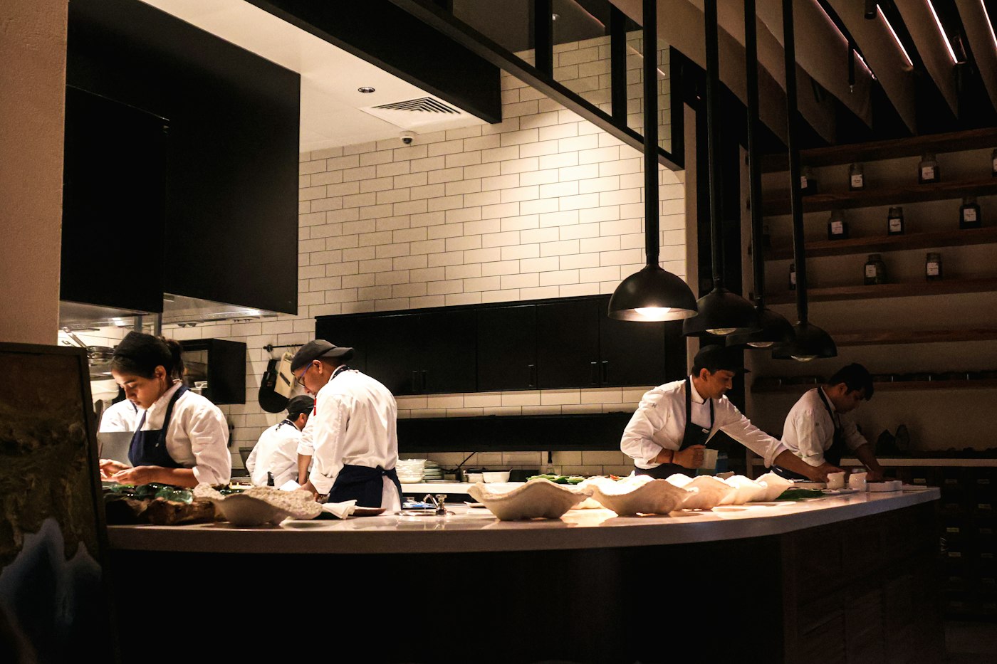 Chefs working together in a modern restaurant kitchen