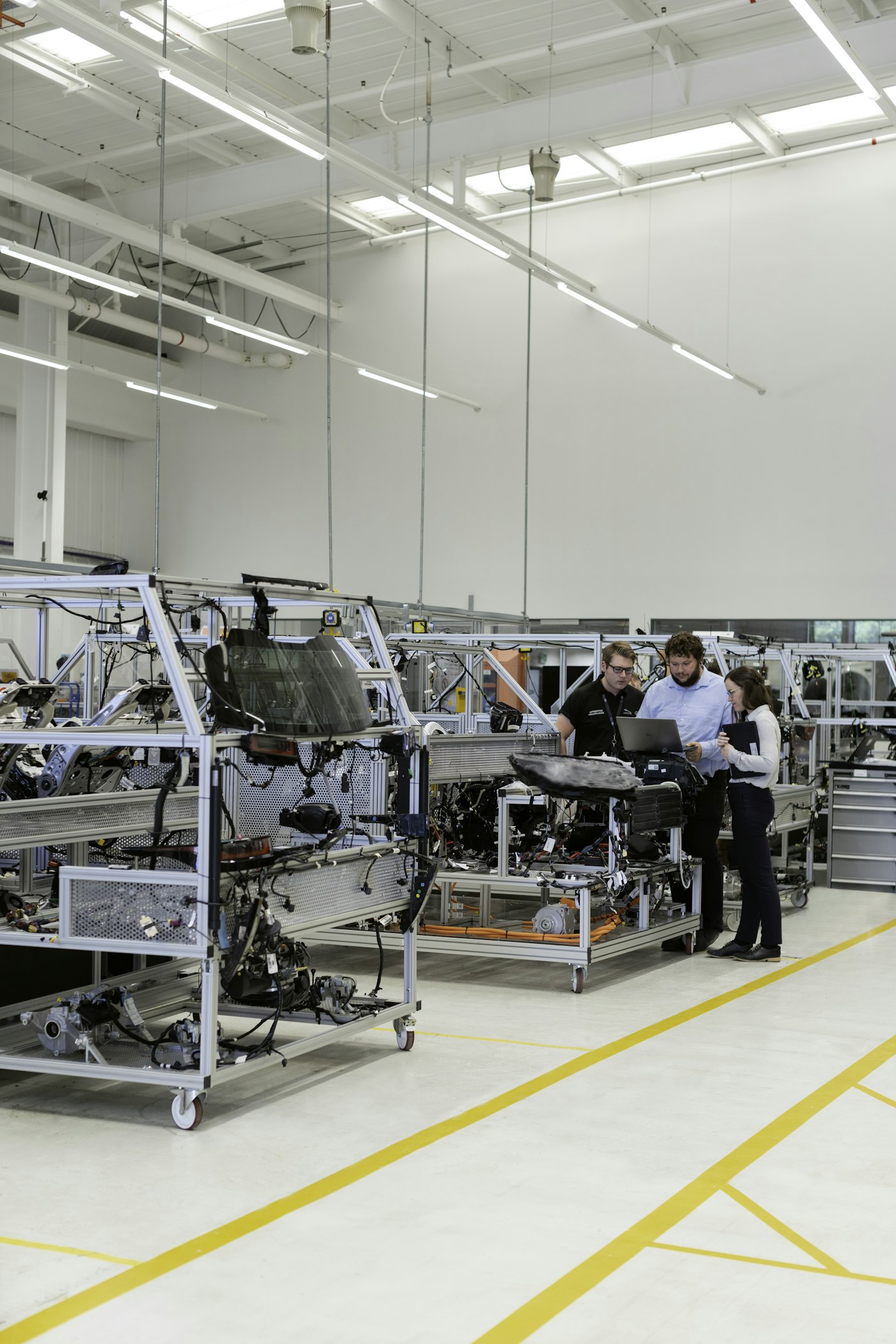 Engineers working together in an automotive factory